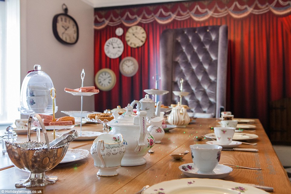 Perfect tea party! The large dining room table comes complete with engraved quotes from the book, with them mirrored on the other side and if you are looking at them through a looking glass 