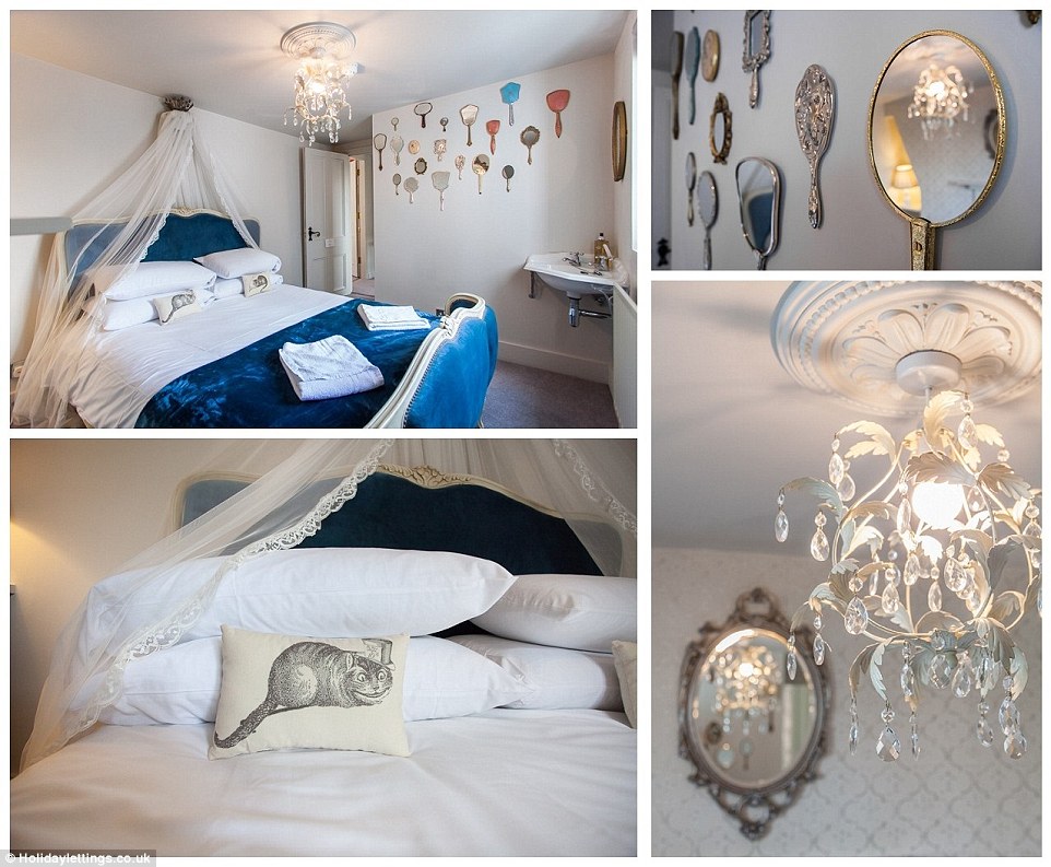 Purrfect sleep! Alice's room features smiling Cheshire Cats and multiple mirrors, in a nod to the second book in Lewis Carroll's series