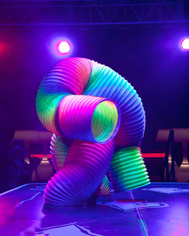 See Footage of Man Dancing Inside a Giant Rainbow Slinky 1